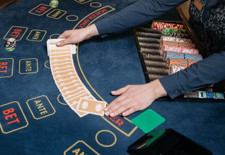 Dealer dealing cards at a live table